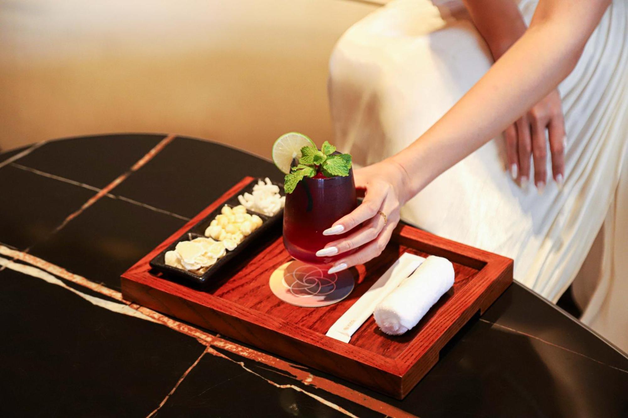 Vias Hotel Vung Tau - Transportation Included Экстерьер фото A woman holding a drink